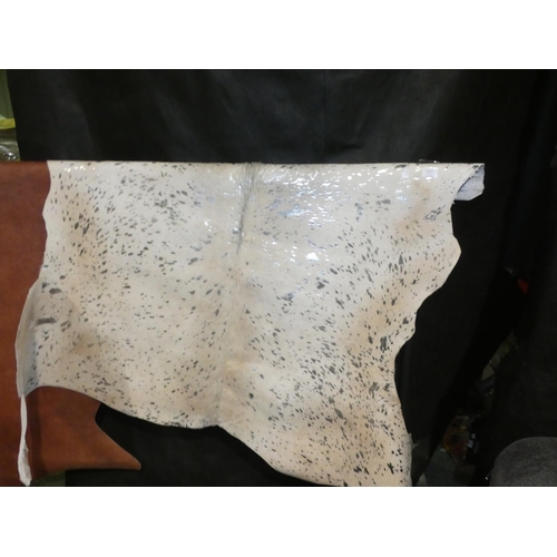 3227 - A cream and silver cow hide rug * this lot is subject to VAT