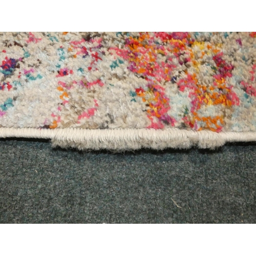 3249 - A multi-coloured patterned rug (275 x 365cm) * this lot is subject to VAT (11 Nov)