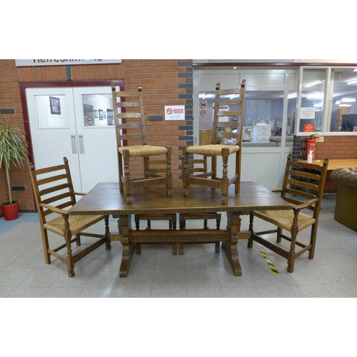 106 - A Nigel Griffiths oak refectory table and six chairs (table dimensions; 74cms h, 90cms w, 182cms l