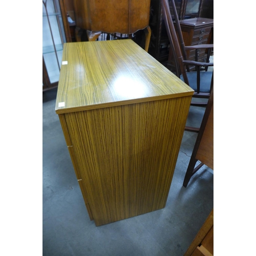 201 - A teak chest of drawers