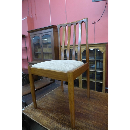 204 - A teak drop-leaf table and four chairs