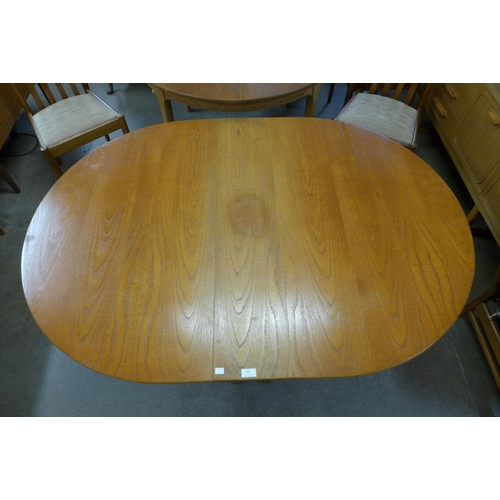 204 - A teak drop-leaf table and four chairs