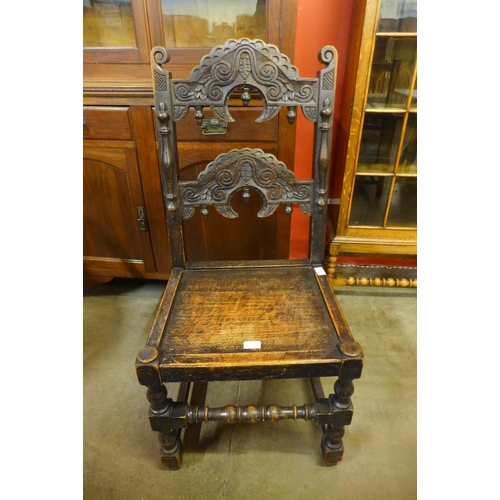 234 - A Carolean style carved oak side chair