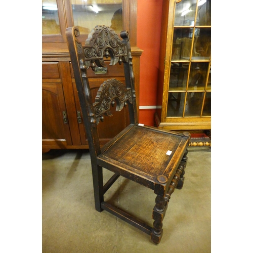 234 - A Carolean style carved oak side chair