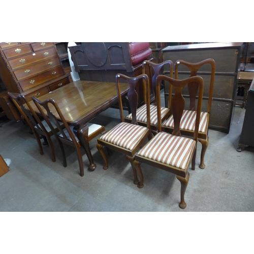 296 - A Victorian mahogany dining table, 75 cms h, 126 cms l, 107 cms w and six mahogany dining chairs