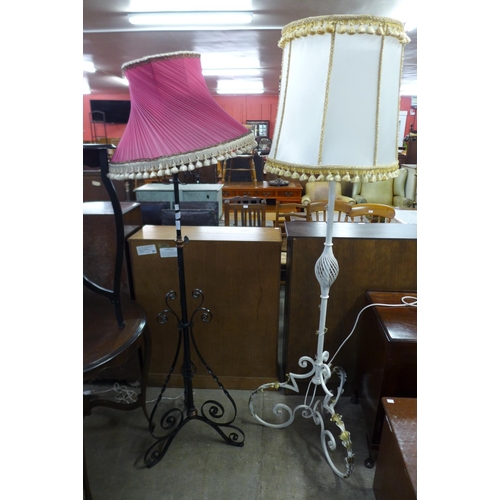 322 - A Victorian wrought iron and copper telescopic standard lamp and a painted standard lamp