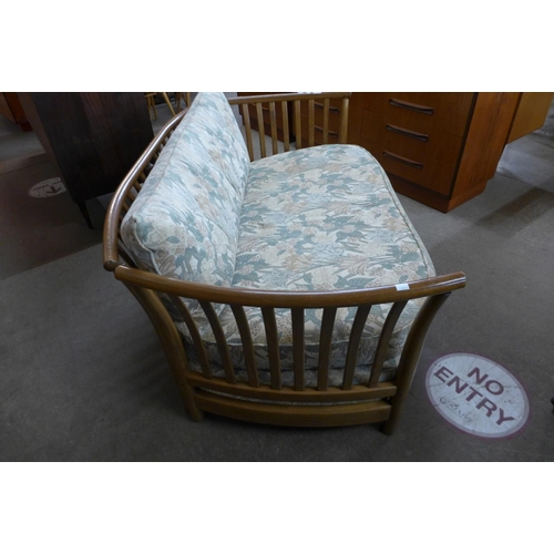 165 - An Ercol Golden Dawn elm settee