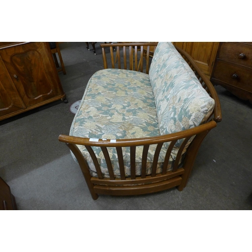 165 - An Ercol Golden Dawn elm settee