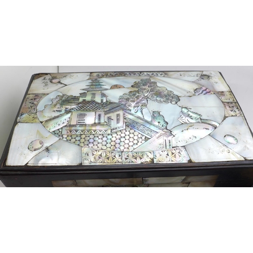 653 - Two small mother of pearl inlaid boxes with assorted chess pieces, a/f, largest box 24cm wide