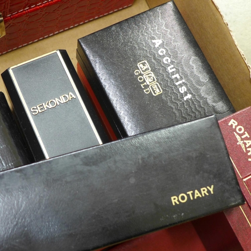 679 - An assortment of empty watch boxes, named including Rotary, Accurist, Sekonda, and a case for twenty... 