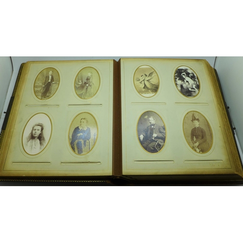 690 - A Victorian album containing eighty cabinet cards and carte de visite