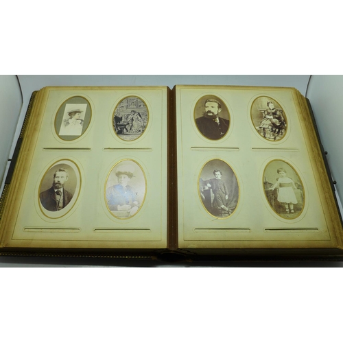 690 - A Victorian album containing eighty cabinet cards and carte de visite