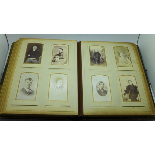 690 - A Victorian album containing eighty cabinet cards and carte de visite