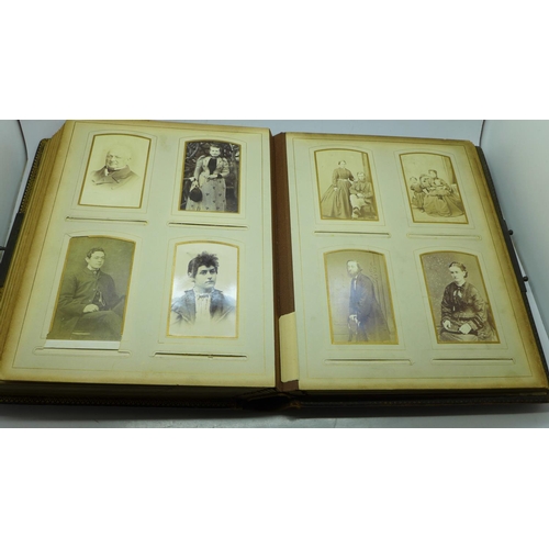 690 - A Victorian album containing eighty cabinet cards and carte de visite