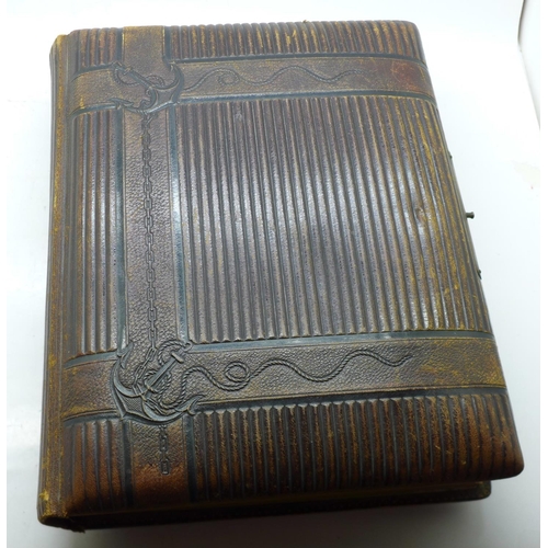 690 - A Victorian album containing eighty cabinet cards and carte de visite