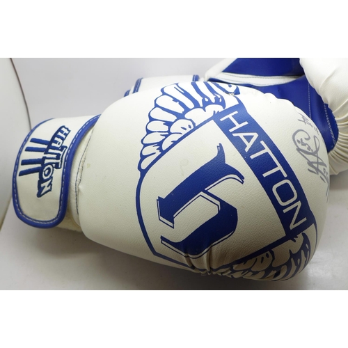 700 - A pair of Hatton boxing gloves, each signed by Carl Froch