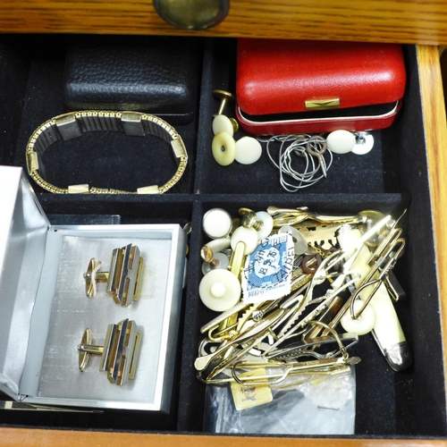 716 - A large jewellery chest with costume jewellery, tie-pins and cufflinks