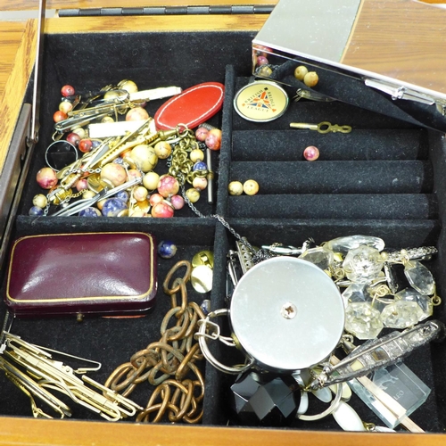 716 - A large jewellery chest with costume jewellery, tie-pins and cufflinks