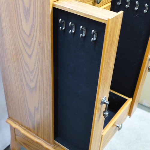 716 - A large jewellery chest with costume jewellery, tie-pins and cufflinks