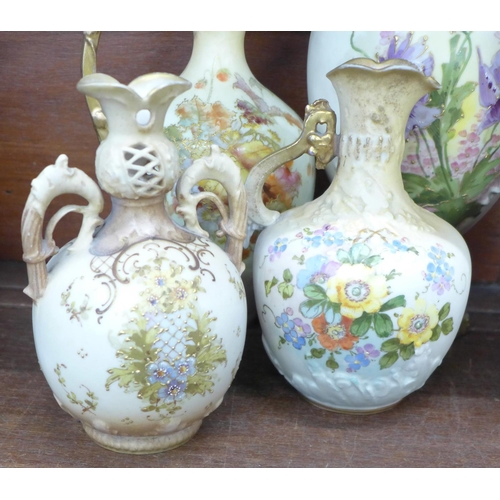 767 - Seven late 19th/early 20th Century blush ivory vases; Austria and others