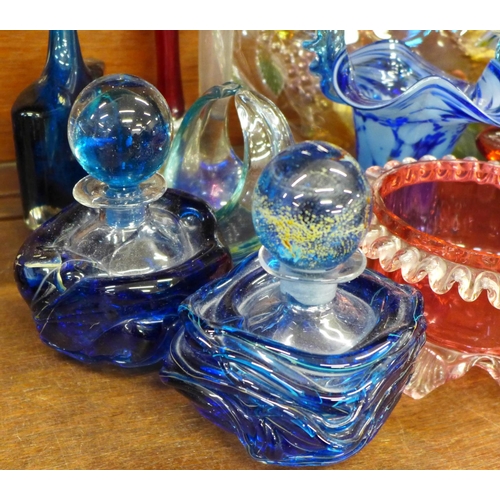 769 - Studio glass including an axe head vase, M'dina vase, three glass baskets, two scent bottles, shallo... 