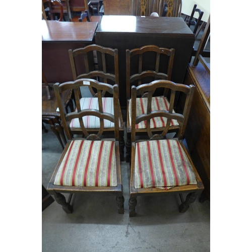 329 - A set of four oak dining chairs