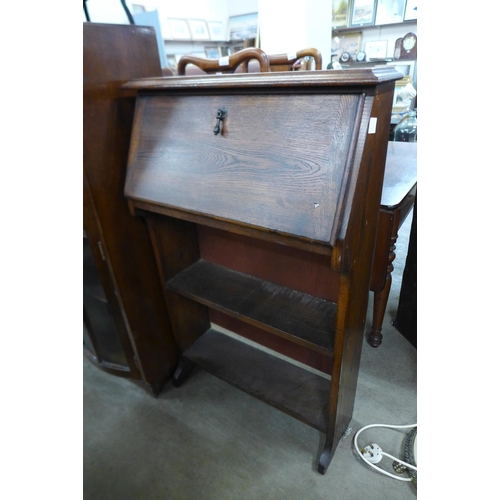 335 - An oak side by side bureau bookcase and a student's bureau