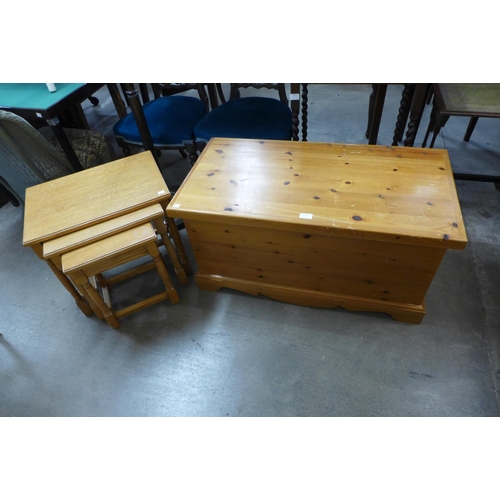 336 - A pine blanket box and an oak nest of tables