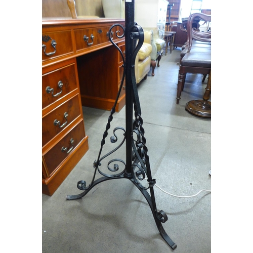 351 - A Victorian wrought iron telescopic standard lamp