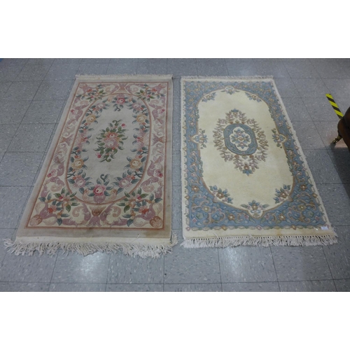 358 - Two Chinese rugs, 170 x 93cms and 163 x 89cms