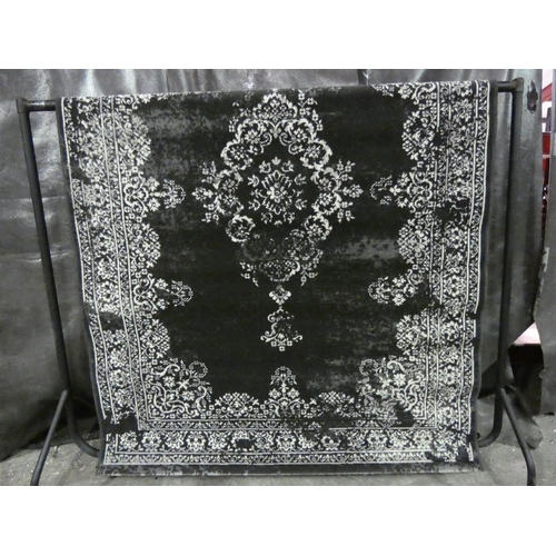 3304 - A black flat weave rug * this lot is subject to VAT