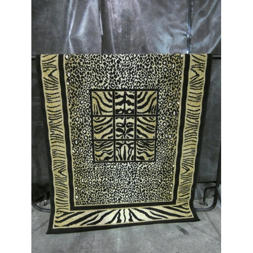 3309 - A Macgregor black rug (140 x 200cm) * this lot is subject to VAT