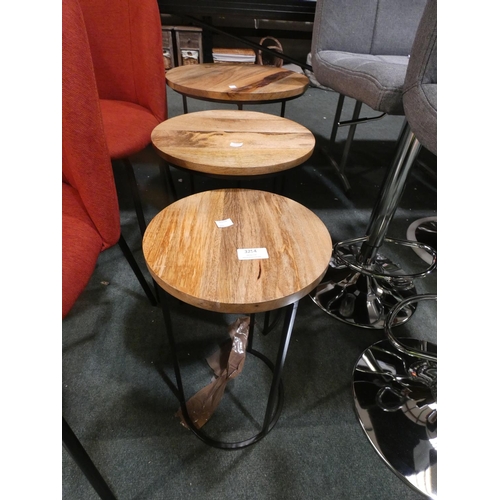 3254 - A wood/metal nest of three circular tables * this lot is subject to VAT