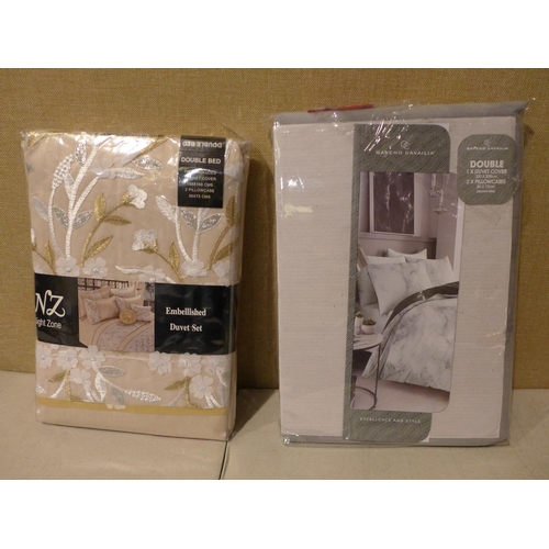 3180 - Two mixed style double duvet sets * this lot is subject to VAT