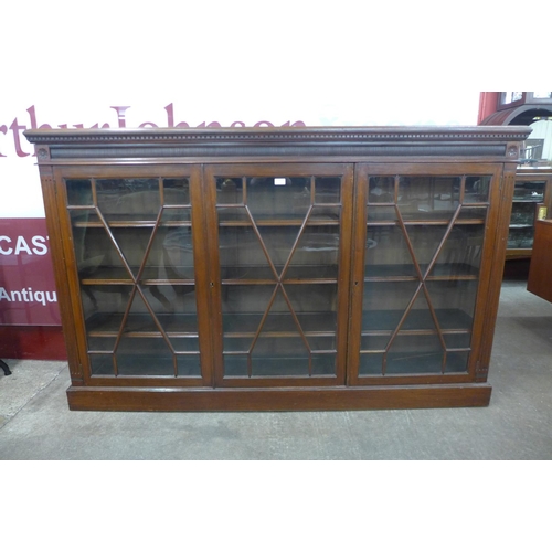 100 - A Victorian mahogany astragal glazed three door bookcase, 116cms h, 184cms w, 34cms d