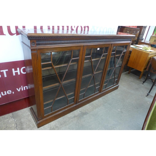 100 - A Victorian mahogany astragal glazed three door bookcase, 116cms h, 184cms w, 34cms d