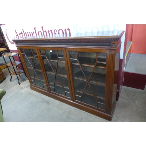 100 - A Victorian mahogany astragal glazed three door bookcase, 116cms h, 184cms w, 34cms d