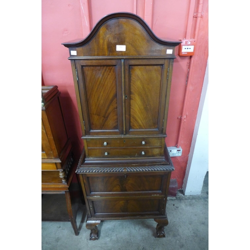 104 - An Edward VII mahogany dome top side cabinet, 150cms h, 59cms w, 37cms d