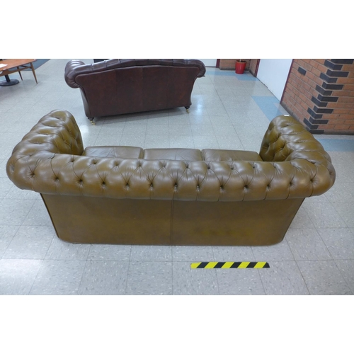 105 - A Chesterfield olive green leather settee, 75cms h, 206cms w, 82cms d