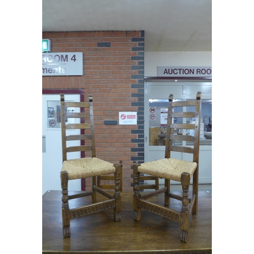 106 - A Nigel Griffiths oak refectory table and six chairs (table dimensions; 74cms h, 90cms w, 182cms l