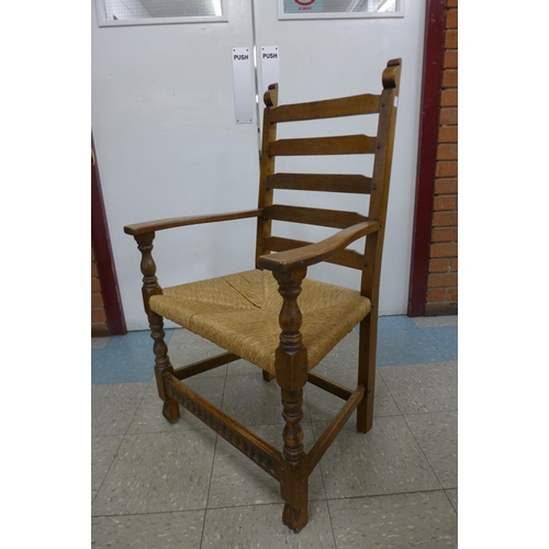 106 - A Nigel Griffiths oak refectory table and six chairs (table dimensions; 74cms h, 90cms w, 182cms l