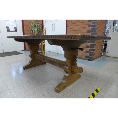 106 - A Nigel Griffiths oak refectory table and six chairs (table dimensions; 74cms h, 90cms w, 182cms l