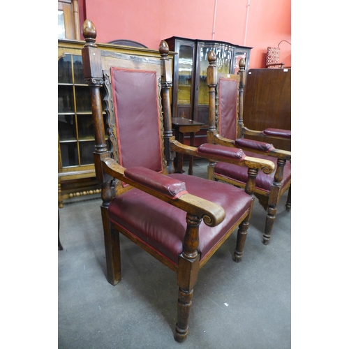 110 - A pair of similar Victorian carved oak and upholstered armchairs, 134cms h, 72cms w70cms d