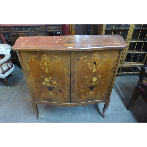 112 - An early 20th Century French amboyna, Kingwood  and marquetry inlaid serpentine side cabinet, 110cms... 