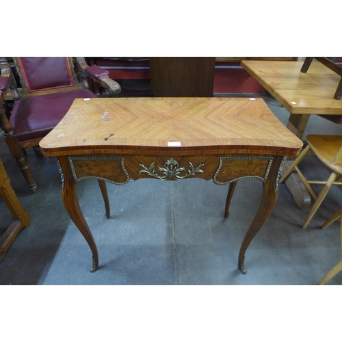 113 - A French Louis XV style mahogany, walnut and gilt metal mounted serpentine card table, 77cms h, 84cm... 