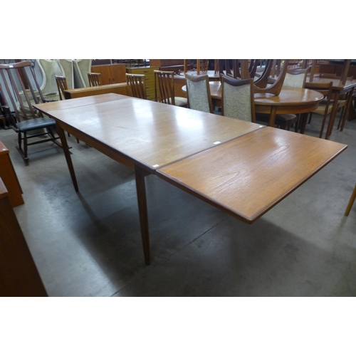 150 - A G-Plan Danish Design teak extending dining table, designed by Ib Kofod Larsen