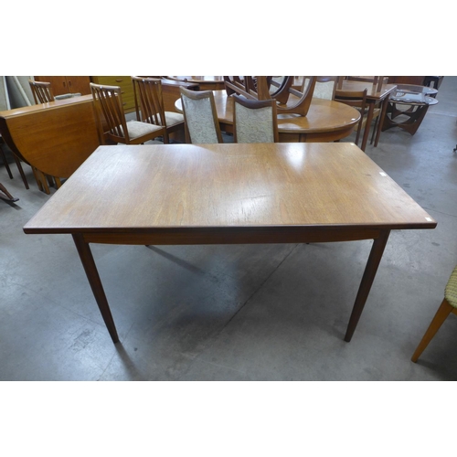 150 - A G-Plan Danish Design teak extending dining table, designed by Ib Kofod Larsen