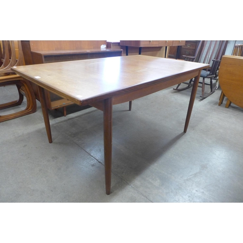 150 - A G-Plan Danish Design teak extending dining table, designed by Ib Kofod Larsen