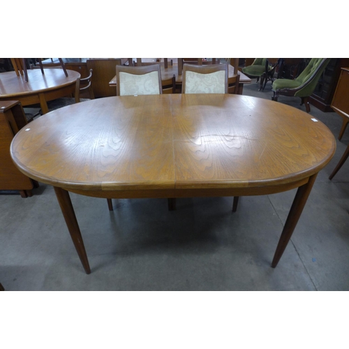 151 - A G-Plan Fresco teak extending dining table and four chiars