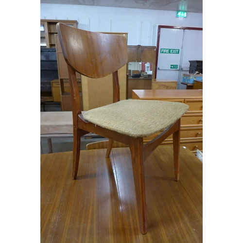 177 - A teak extending dining table and four chairs